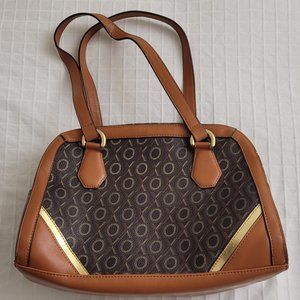 XOXO brown plastic makeup travel bag.